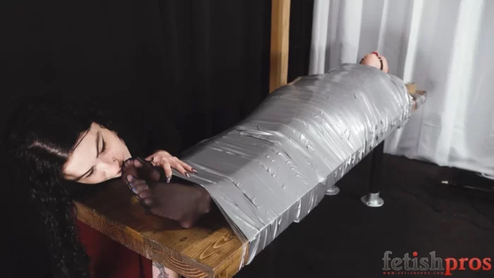 Arielle Aquinas, Lydia Black In Scene: Arielle Aquinas In a Duct Tape Cocoon Under Lydia Black - FETISH PROS - MP4